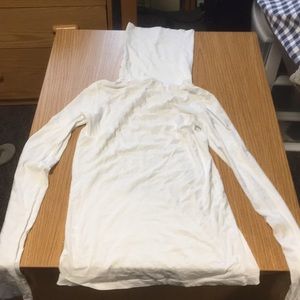 White turtleneck sweater:brand is “theory”